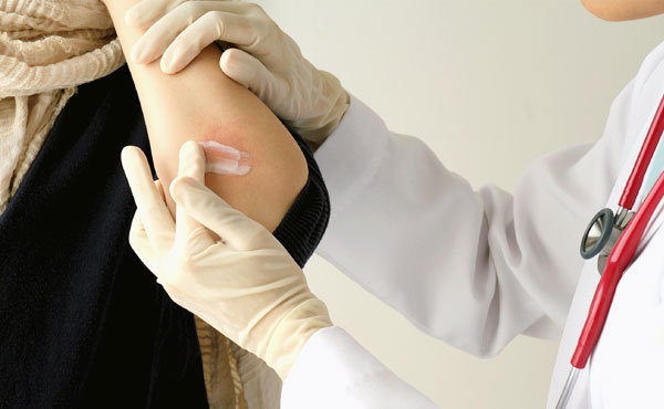 doctor treating injury